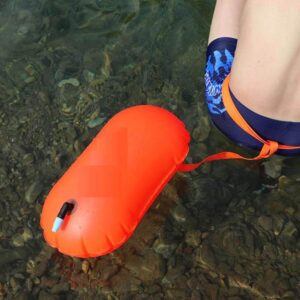 Bright orange swim buoy rental with dry storage for safe swimming in Tenerife